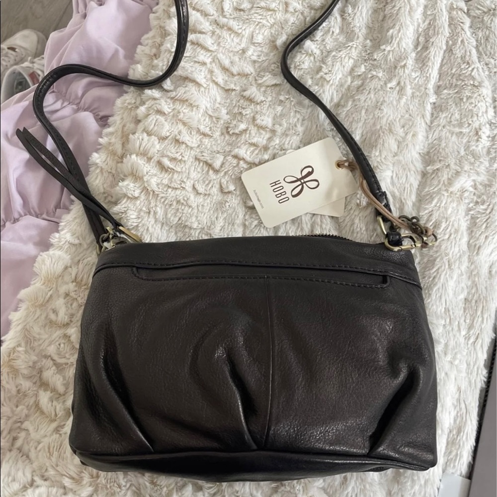 Never used, brand new with tags!! Hobo purse, wallet and key chain set.